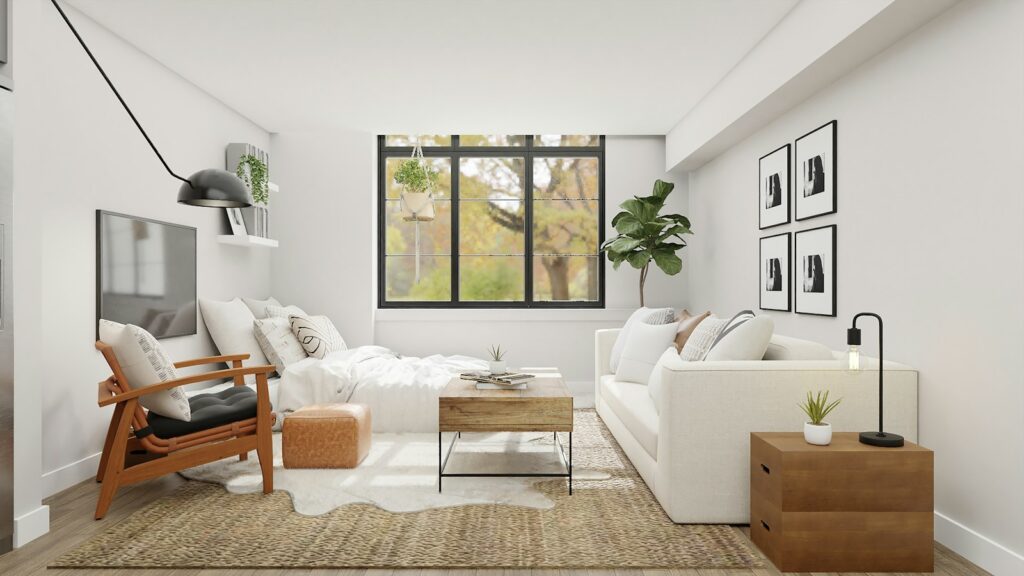 Kleine Räume einrichten: helles Wohnzimmer mit weißem Sofa vor großer Glasfront